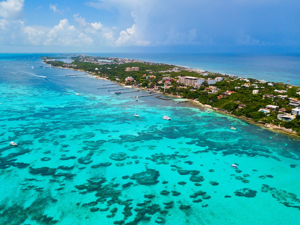 aerial view of mexico's caribbean coastline with turquoise waters and tropical beaches.
